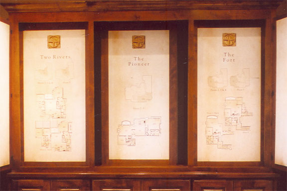 House floorplans printed with a parchment background and mounted in a custom cabinet