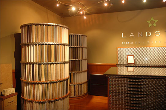 Carpet samples displayed in a custom tower in the Landstar Homes showroom