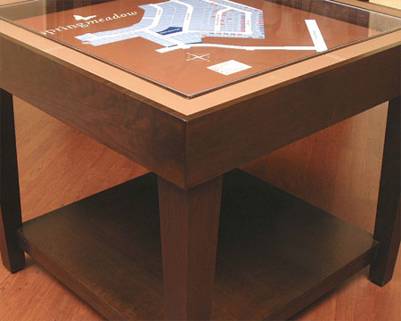 A square site map table with a seude edge
