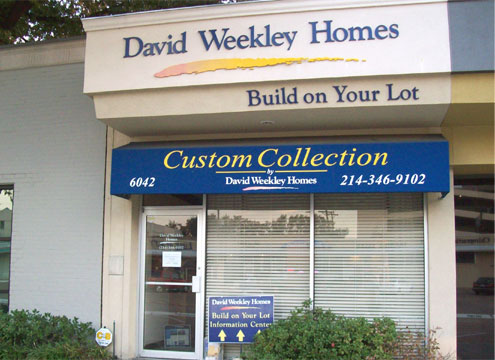 Blue routed letters mounted on an exterior wall