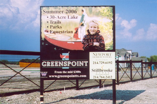 A large square sign advertising community amenities