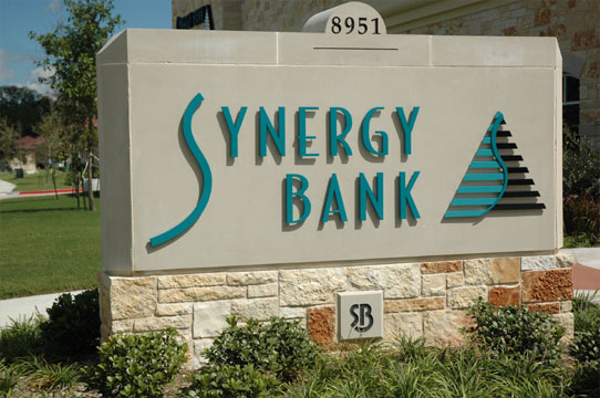 Synergy Bank simple white stone monument